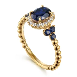 Best Gabriel & Co. 14K Yellow Gold Bujukan Diamond Halo and Oval Blue Sapphire Fashion Ring
